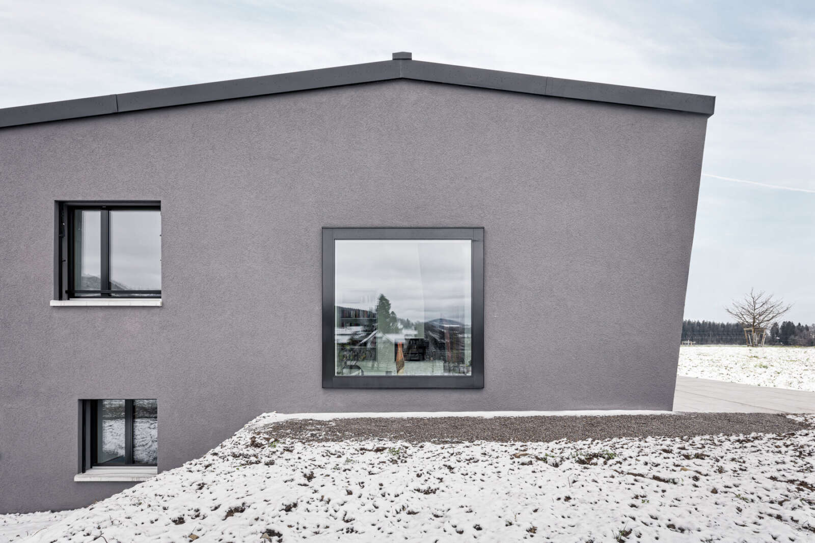 Orlando Architektur Neubau Einfamilienhaus Rigiblickstrasse Hausen am Albis 8 Fassade Detail Panoramafenster